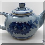P32. Blue stoneware tea pot with flowers - $18